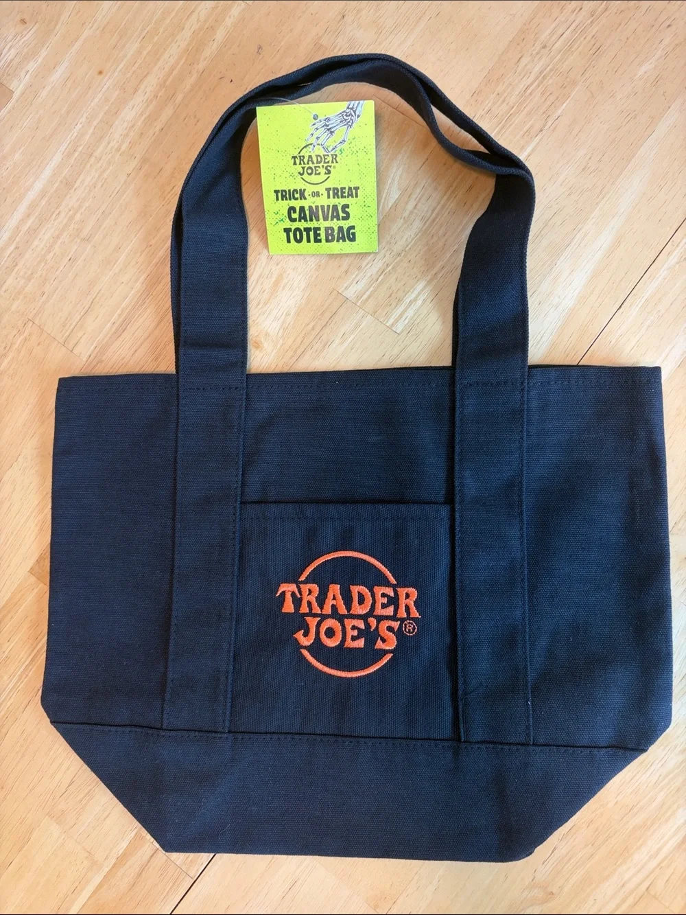 NWT Trader Joe’s Trick or Treat Black Canvas Tote Bag with Orange Logo - Picture 1 of 3